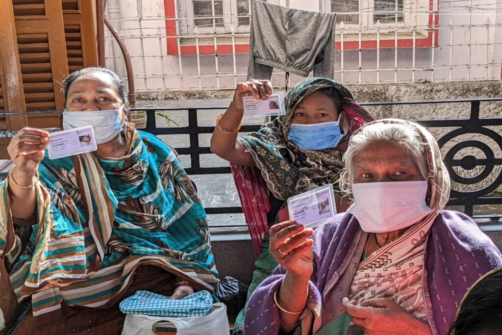 elderly patients with their patient photo ID cards